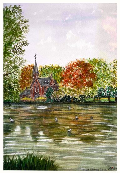 Iglesia rodeada de árboles de colores otoñales junto a un estanque con patos.