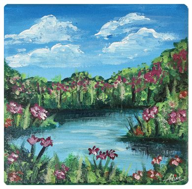 Paisaje con lago rodeado de flores de colores y cielo azul con nubes.